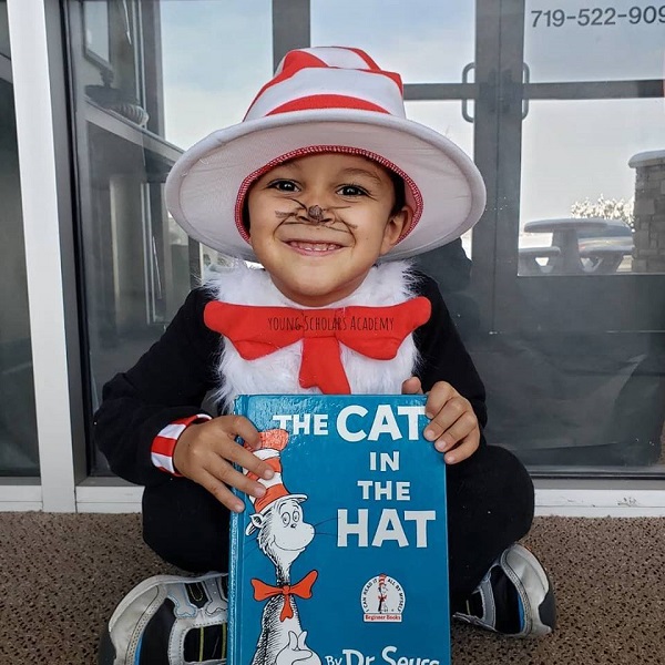 Child with Dr Suess book