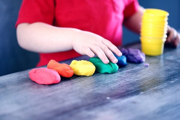 child with play dough