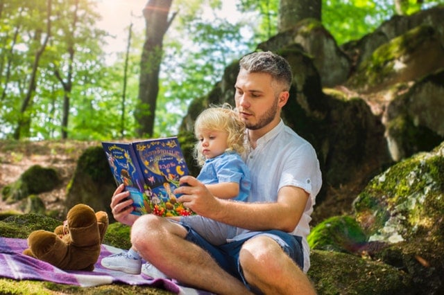 father and daughter reading