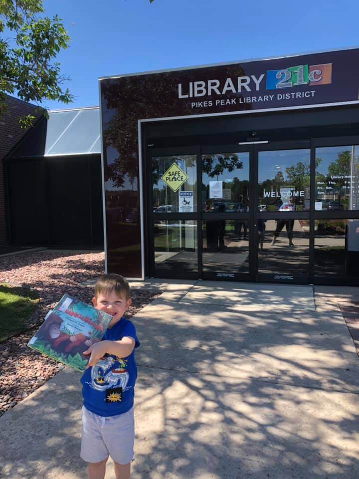 boy outside library